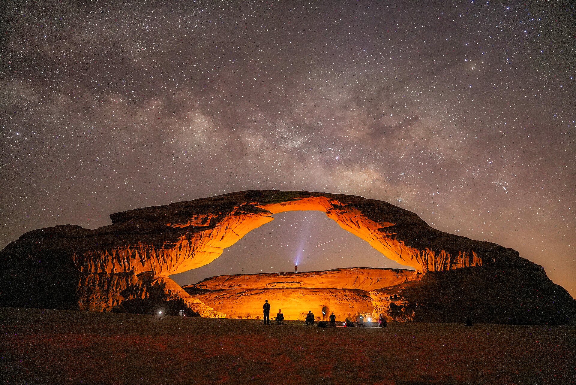 A real wide landscape photograph of AlUla’s sandstone formations and desert terrain